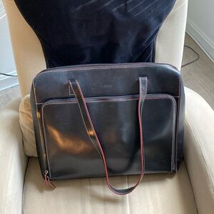 LODIS laptop/briefcase. Black with red trim. Very good used condition. Leather.